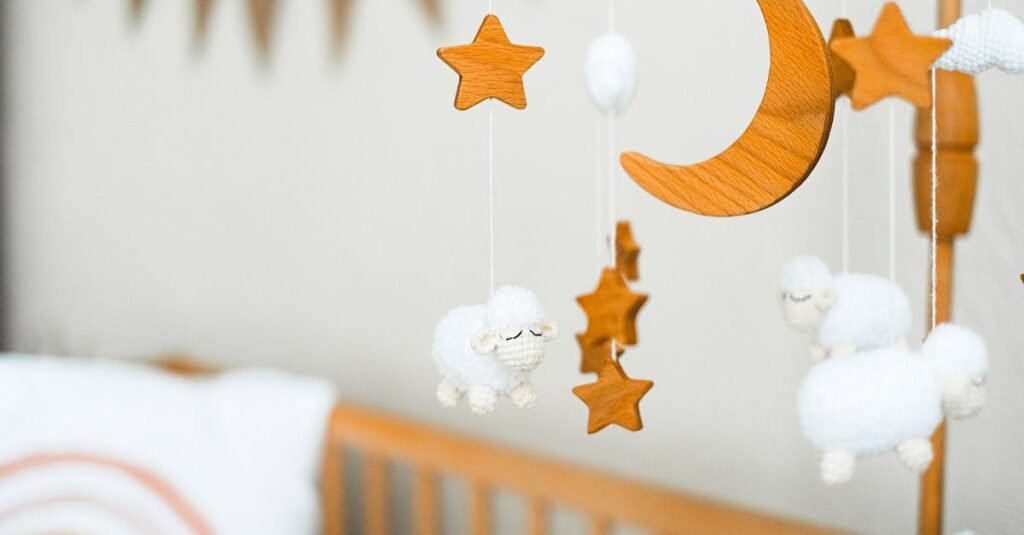 Wooden crib mobile featuring stars, a crescent moon, and fluffy sheep for a cozy baby nursery.
